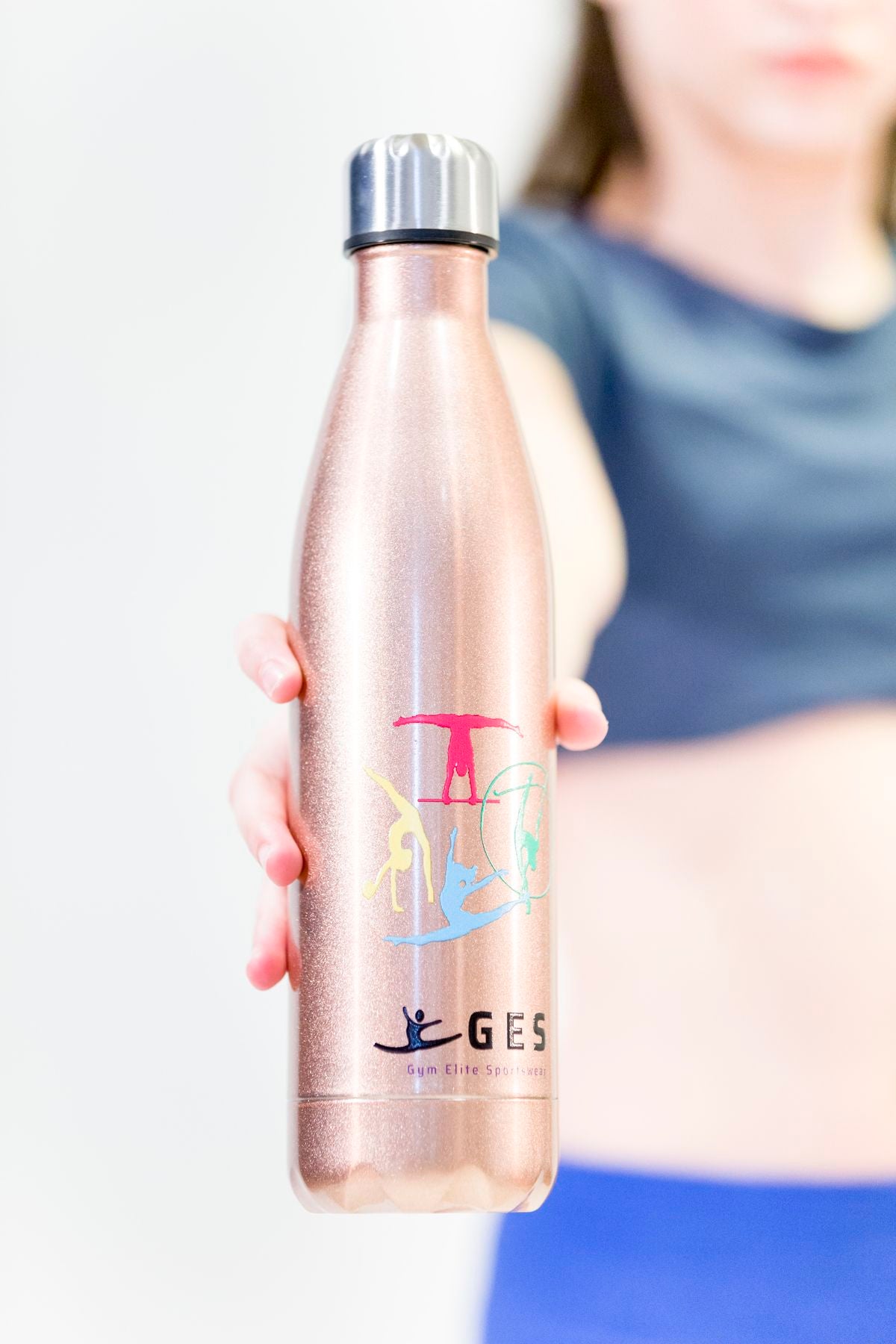 Give your water cooler a fresh and sustainable upgrade with the rose gold Gymnastics Passion water bottle, embellished with a gymnastics stamp.  Made using premium food grade, non-leaching stainless steel inox with a BPA free leak proof silicone seal to keep your drink chilled or hot for prolonged periods.  These BPA-free water bottles are perfect for any activity. Hydration never looked so good!